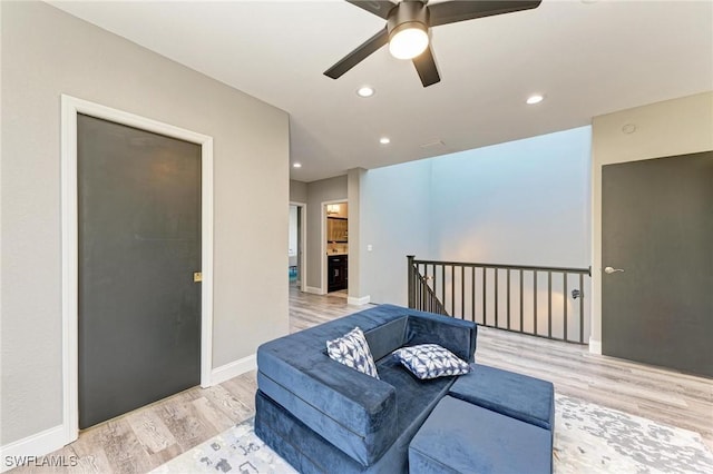 interior space with light wood-type flooring and ceiling fan