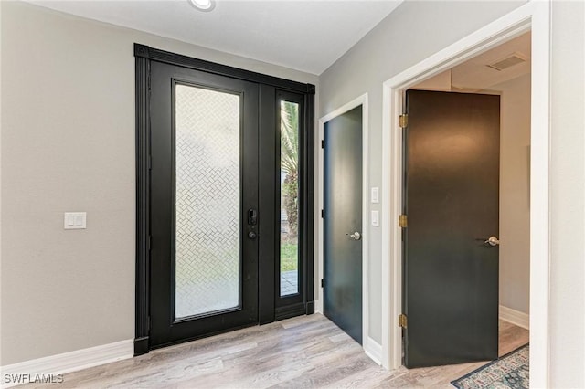 foyer with light hardwood / wood-style flooring