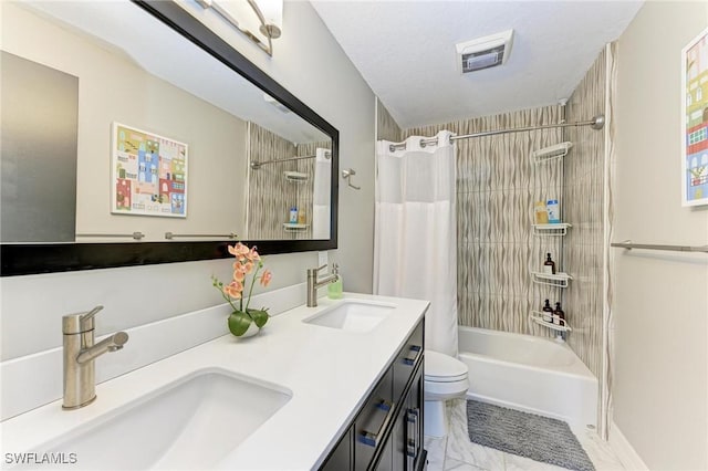 full bathroom featuring vanity, shower / bath combination with curtain, a textured ceiling, and toilet