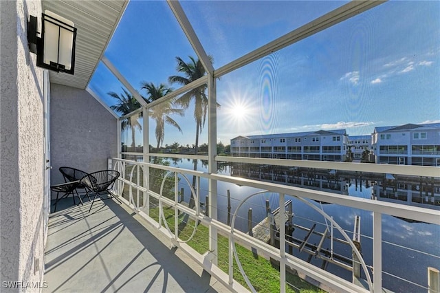 balcony featuring a water view