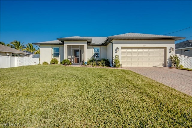 view of front facade with a garage and a front lawn