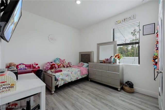 bedroom with light hardwood / wood-style floors