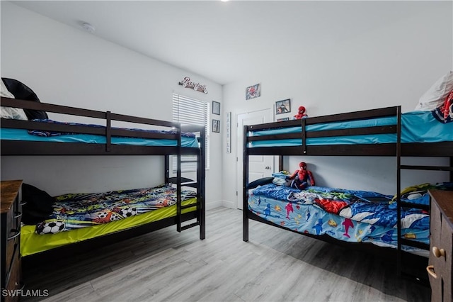 bedroom with hardwood / wood-style flooring