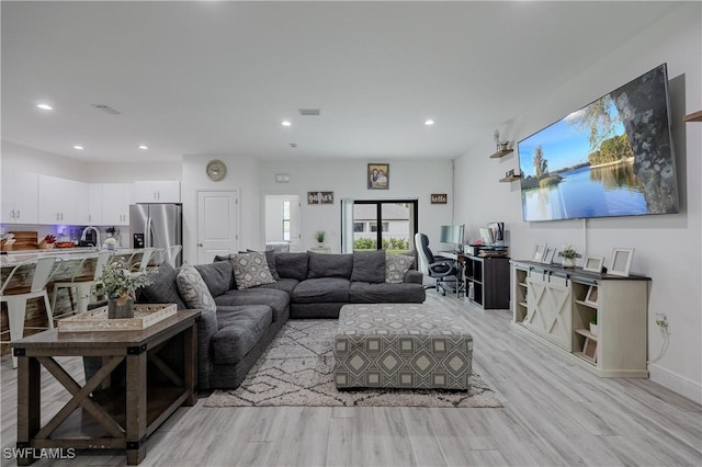 living room with light hardwood / wood-style floors