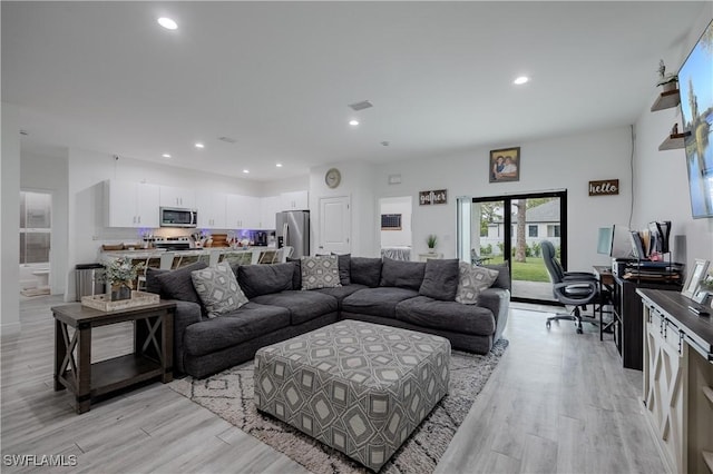 living room featuring light hardwood / wood-style flooring