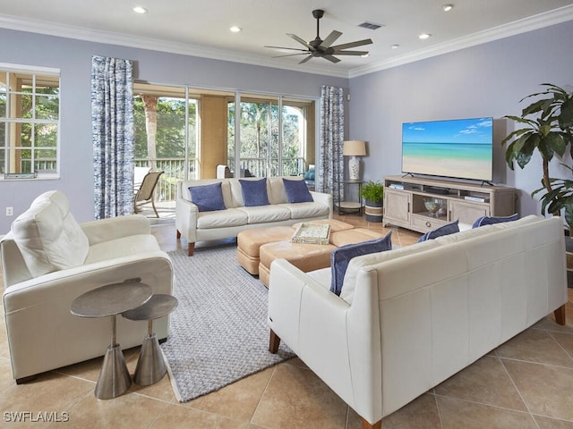 living room featuring light tile patterned floors, ceiling fan, and crown molding