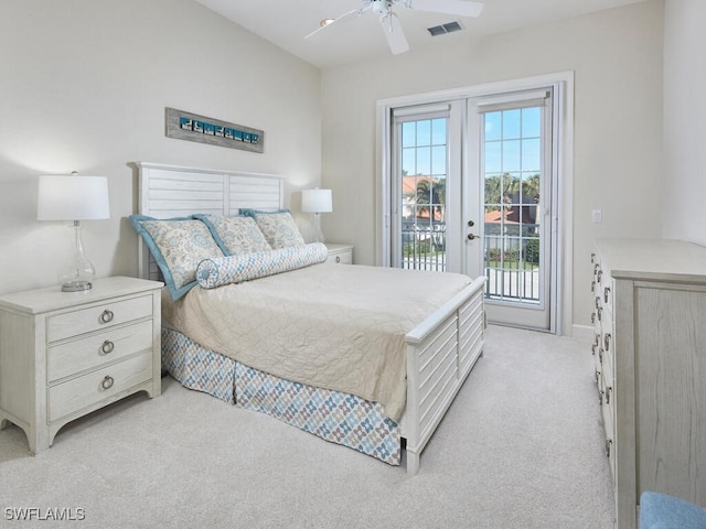 bedroom featuring access to exterior, multiple windows, light colored carpet, and ceiling fan