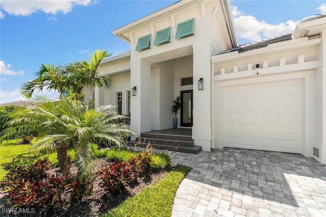 doorway to property featuring a garage