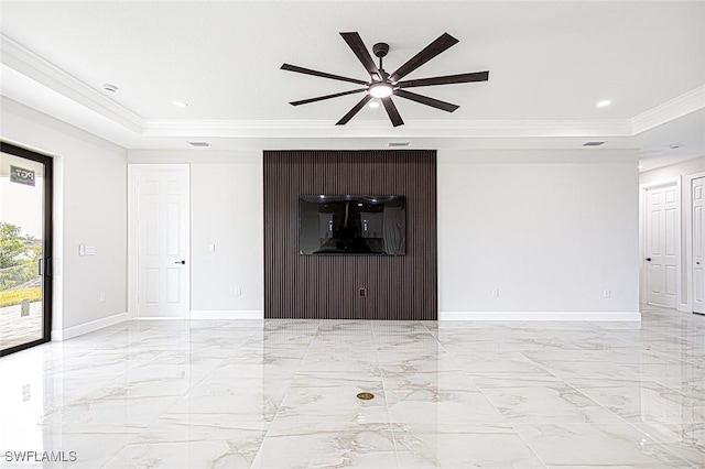 unfurnished room featuring a tray ceiling, ceiling fan, and crown molding