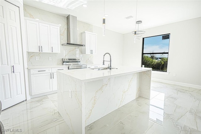 kitchen featuring white cabinetry, sink, electric range, wall chimney range hood, and a kitchen island with sink