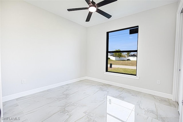 spare room with ceiling fan