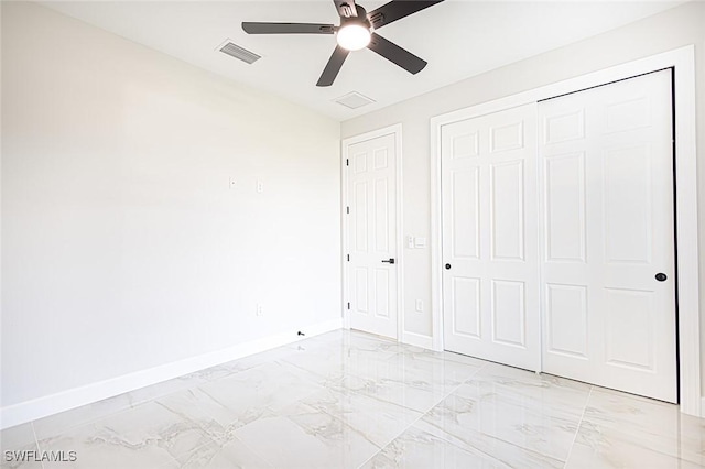 unfurnished bedroom with a closet and ceiling fan