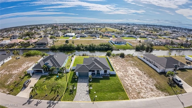 bird's eye view with a water view