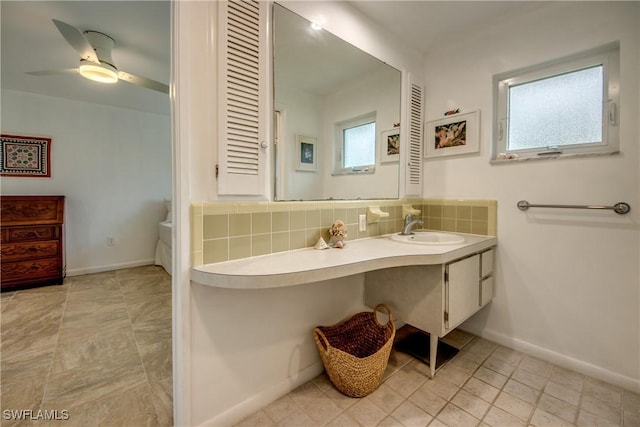 bathroom with tasteful backsplash, vanity, plenty of natural light, and ceiling fan