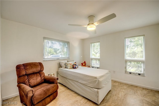 tiled bedroom with ceiling fan