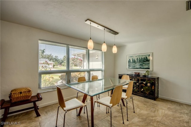 dining area featuring track lighting