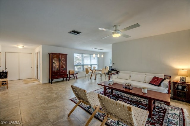 living room with ceiling fan