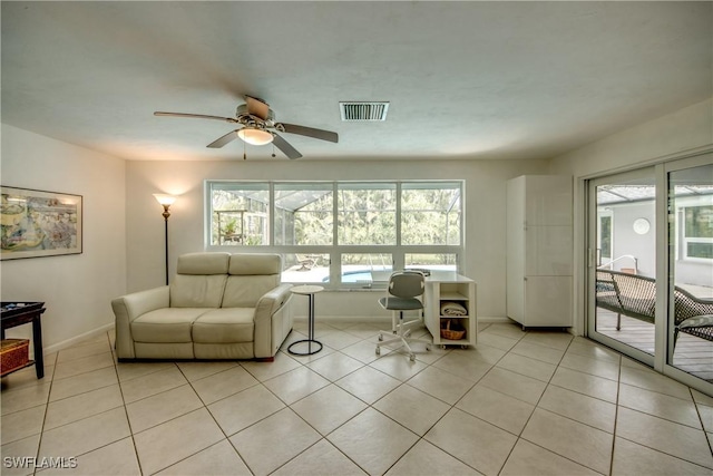 living room with ceiling fan and light tile patterned floors