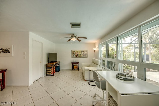 tiled living room with ceiling fan