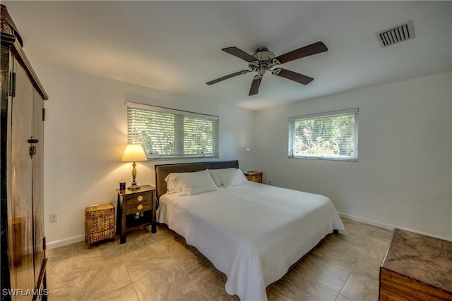 bedroom with light tile patterned flooring and ceiling fan