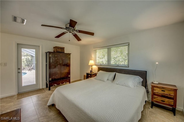 bedroom featuring light tile patterned floors and ceiling fan