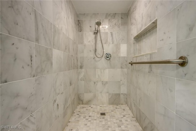 bathroom with tiled shower