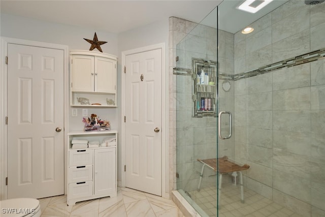 bathroom with toilet and walk in shower