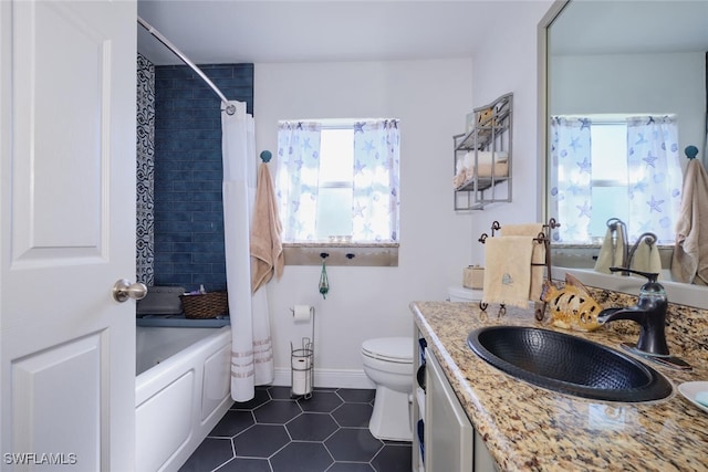 full bathroom featuring tile patterned flooring, shower / tub combo, vanity, and toilet