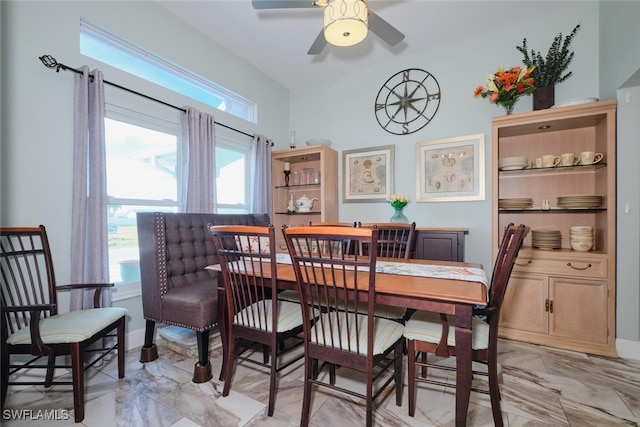 dining space featuring ceiling fan