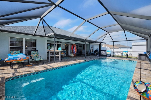 view of pool with a lanai and a patio area