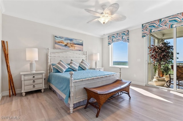 bedroom featuring access to exterior, crown molding, ceiling fan, and light wood-type flooring