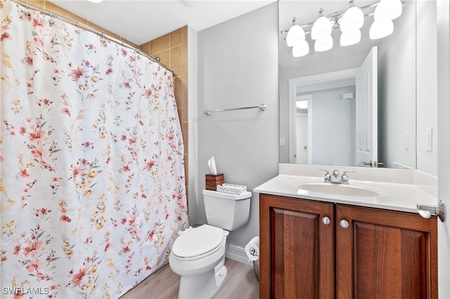 bathroom with vanity, hardwood / wood-style floors, a shower with curtain, and toilet