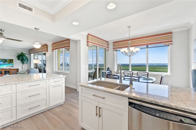 kitchen featuring dishwasher, white cabinets, light stone countertops, and sink