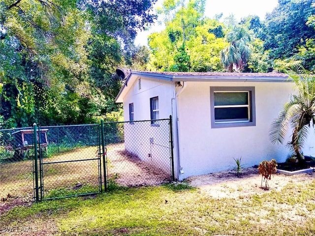 view of property exterior with a yard