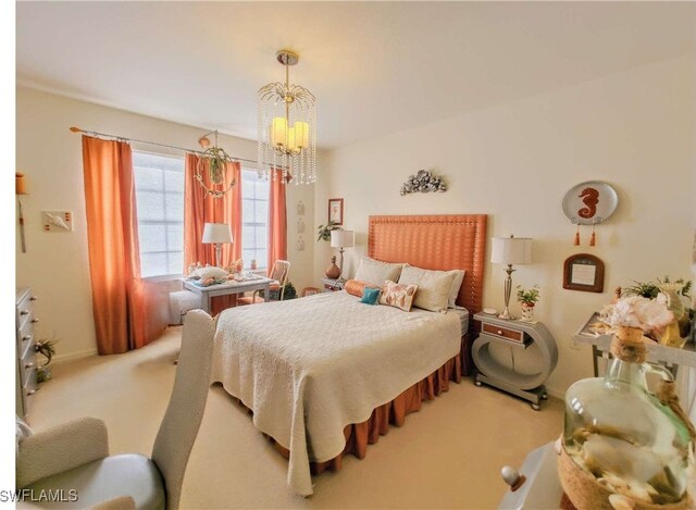 bedroom with a chandelier and carpet flooring