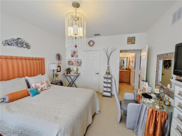 carpeted bedroom featuring a notable chandelier