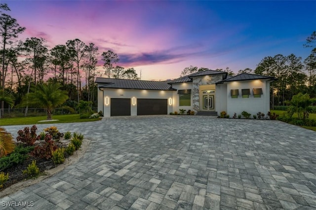 modern home featuring a garage