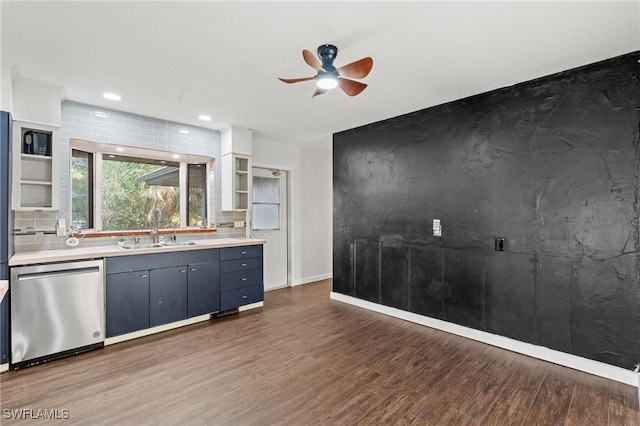 kitchen with ceiling fan, sink, dark wood-type flooring, tasteful backsplash, and stainless steel dishwasher