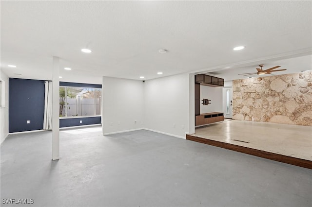 basement featuring ceiling fan