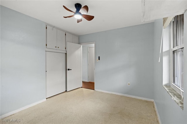 unfurnished bedroom featuring ceiling fan