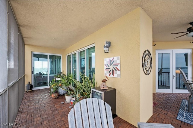 exterior space featuring ceiling fan and french doors