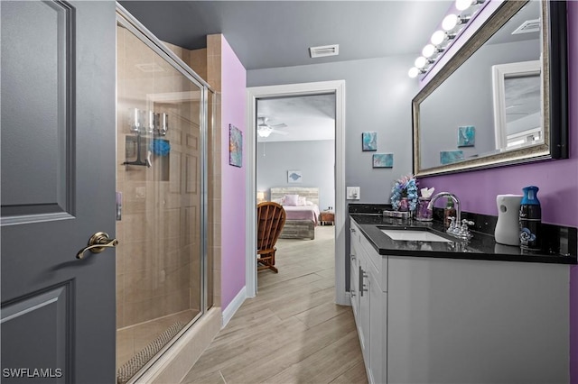 bathroom with vanity and walk in shower