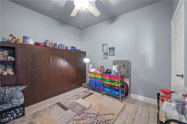 game room featuring ceiling fan and light hardwood / wood-style floors