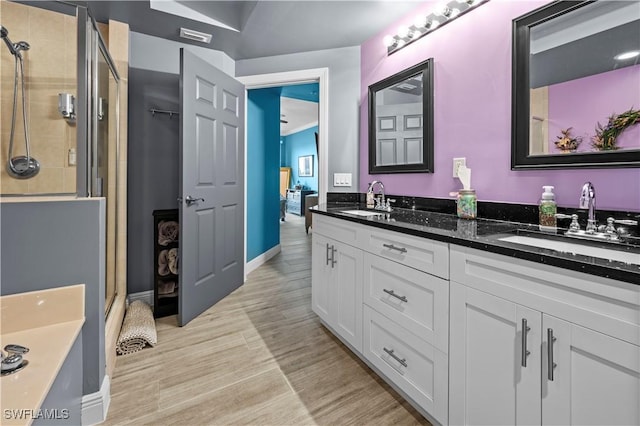 bathroom featuring vanity and walk in shower