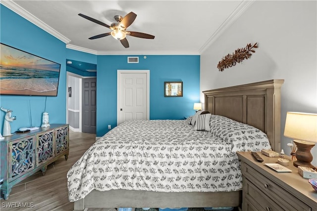 bedroom with ceiling fan, light wood-type flooring, and ornamental molding