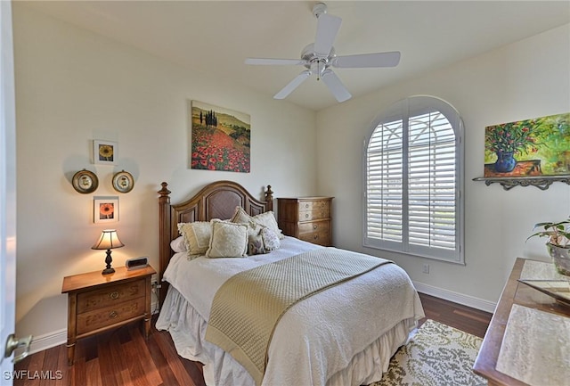 bedroom with dark hardwood / wood-style floors and ceiling fan