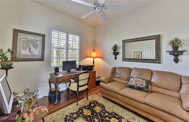 office with hardwood / wood-style floors and ceiling fan