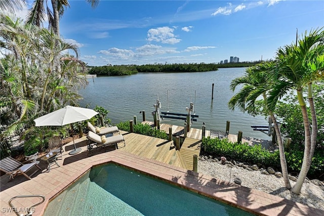 view of pool featuring a water view and a boat dock