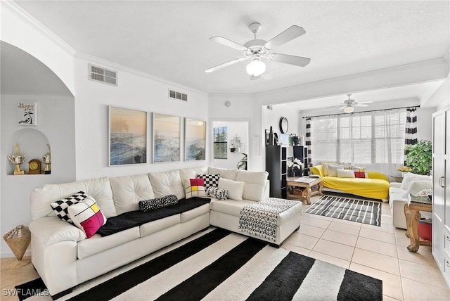 living room with ceiling fan, light tile patterned floors, and crown molding