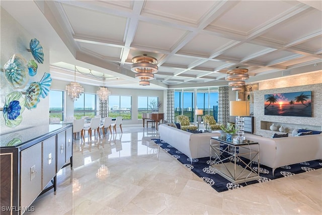 living room with coffered ceiling and a notable chandelier